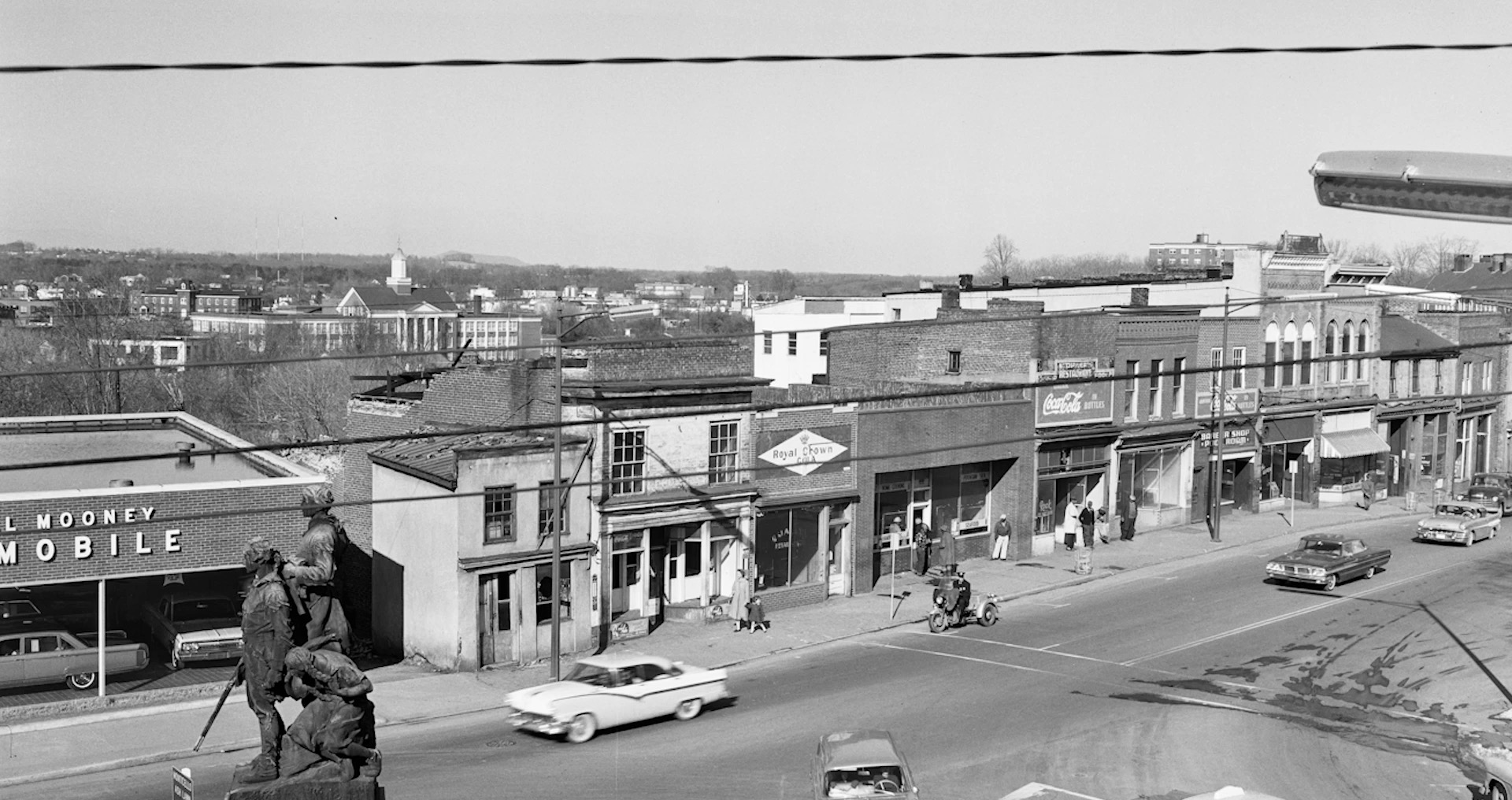 “Main St. Charlottesville - Vinegar Hill” — Businesses located on Main Street in Vinegar Hill, Charlottesville, Virginia, including the Bell family’s Quality Retail Store. Credit “Raised/Razed and the Charlottesville Redevelopment and Housing Authority.